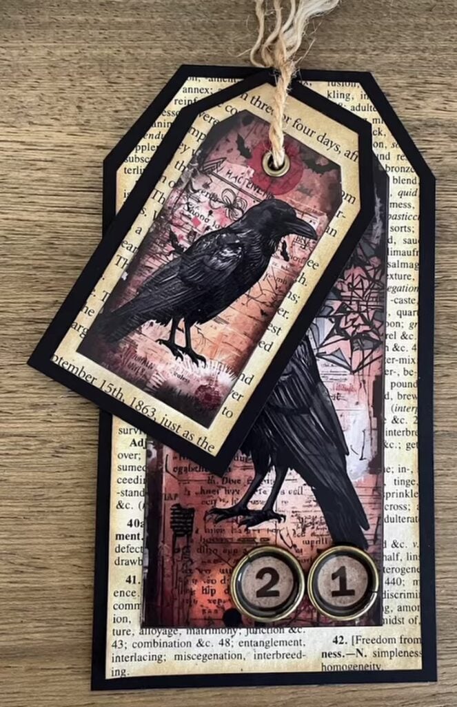 Raven tags layered over torn book pages with vintage labels and inked edges.