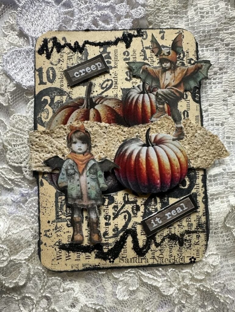 Gothic haunted house scrapbook layout with black flowers, gravestone ephemera, and dramatic dark florals