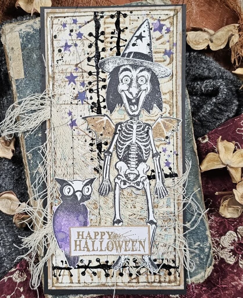 Happy Halloween’ collage page with layered tickets, labels, florals, and stitched borders.