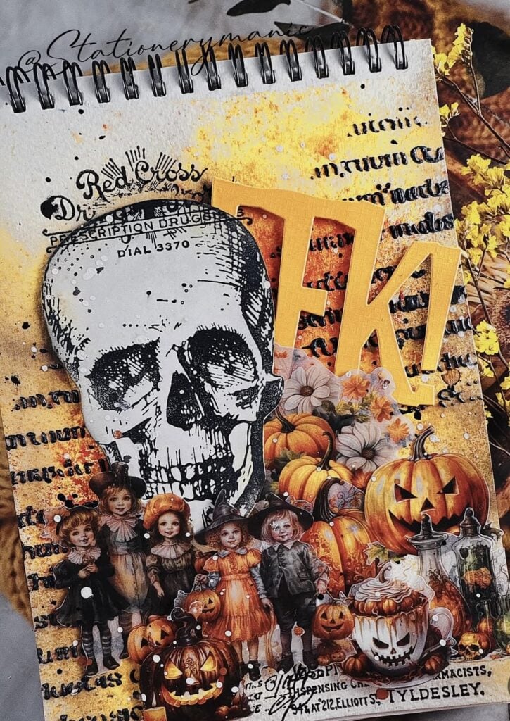 Statement scrapbook page with giant skull focal point, pumpkins, and vintage children imagery.