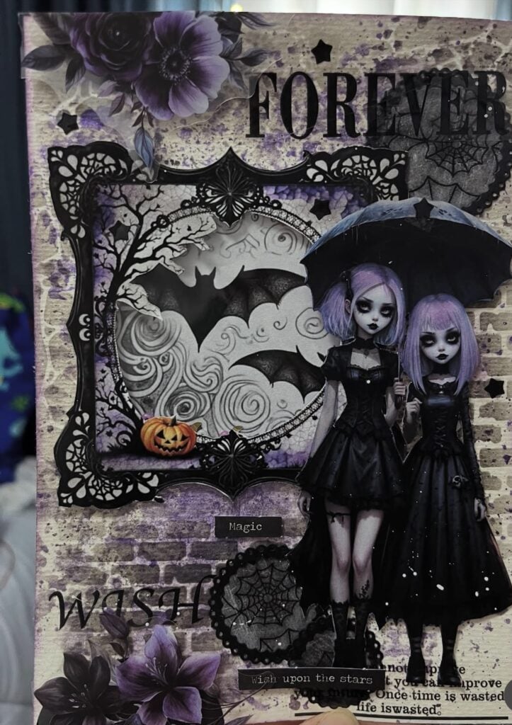 Purple-toned Gothic spread with twin girls, bat accents, ‘forever’ title, and torn paper layers