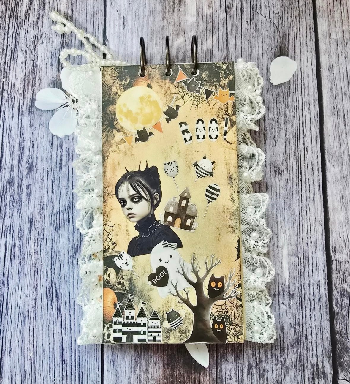 Elegant lace-trimmed Halloween layout with Wednesday Adams, ghost, and crescent moon on a neutral background.