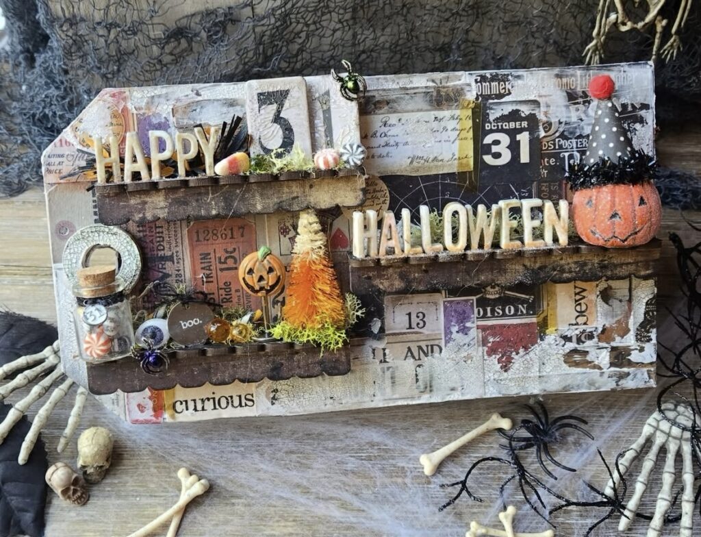 Mixed media Halloween tag with layered tickets, labels, and ‘Happy 31’ title in textured inks.