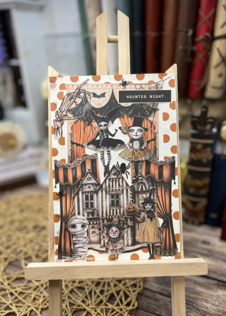 Vintage collage scrapbook page with witch illustrations, pumpkins, ghosts, and bats layered over patterned paper.
