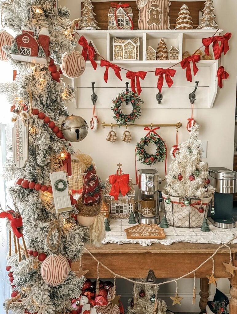 Cozy gingerbread Christmas corner with a red and neutral tree, cookie ornaments, and matching gingerbread decor on nearby shelves.