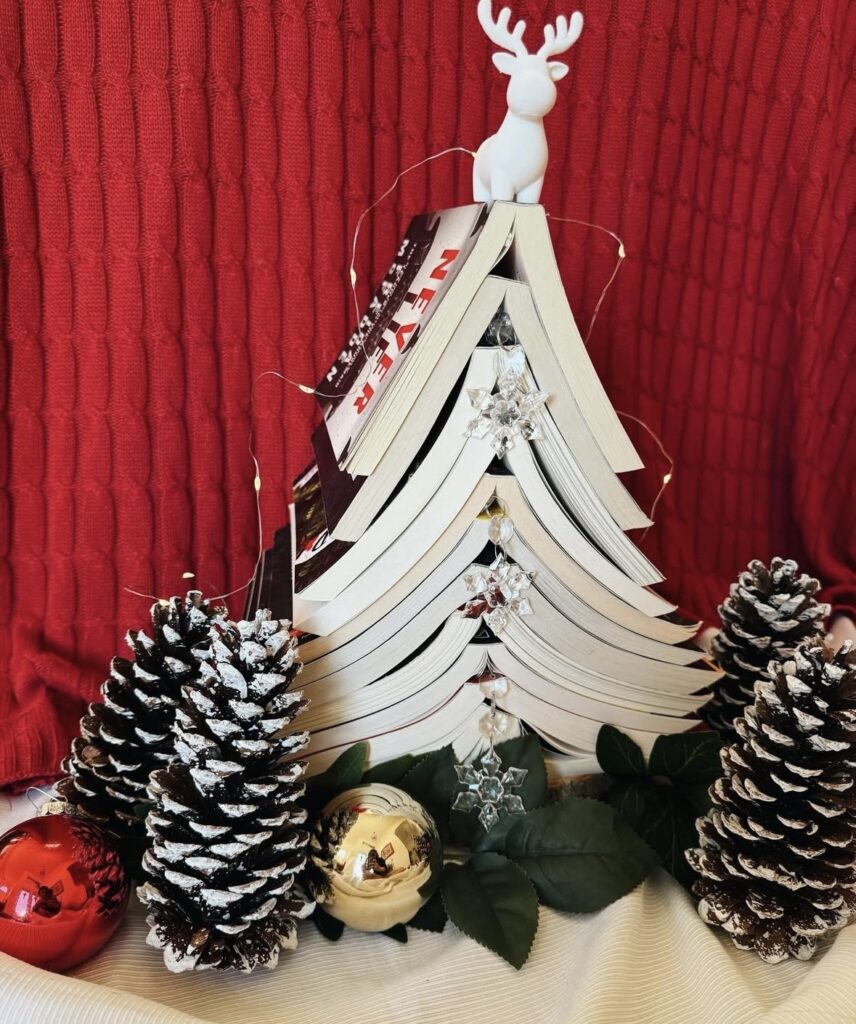 Book tree Christmas tree alternative stacked into a festive shape for book lovers