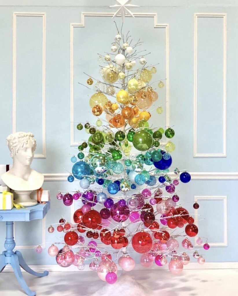 DIY Christmas tree alternative arranged in a creative tree-like shape with holiday decor