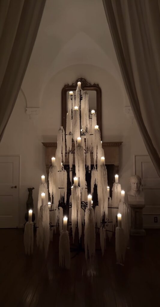 candle lit Christmas tree alternative arranged in a festive triangular shape for small spaces