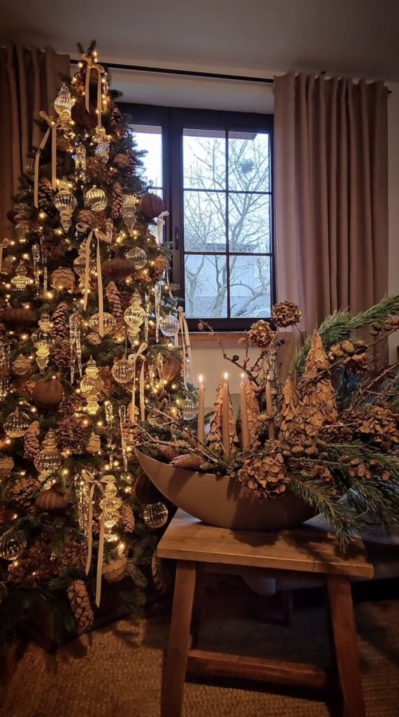 Brown and gold Christmas tree in a cozy living room with warm lights and elegant holiday decor