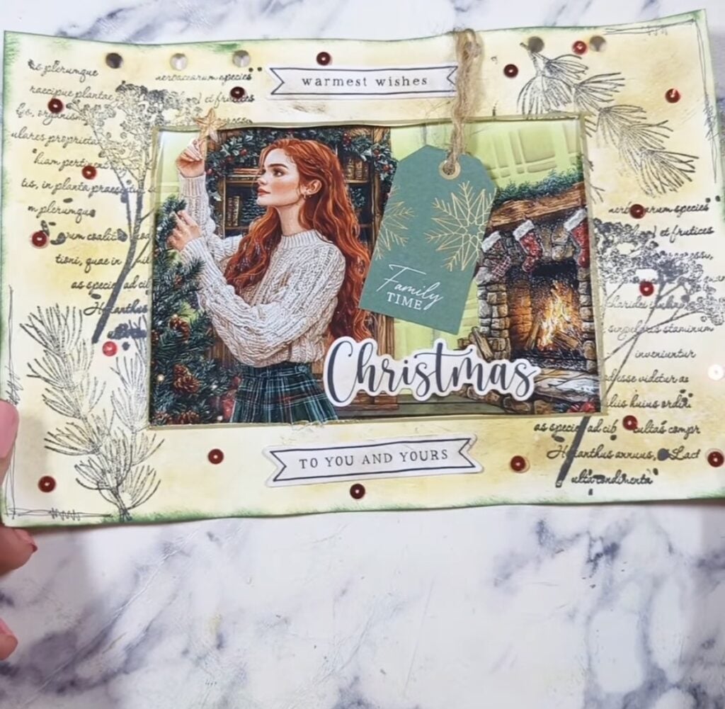 Christmas junk journal spread with layered holiday papers and seasonal ephemera