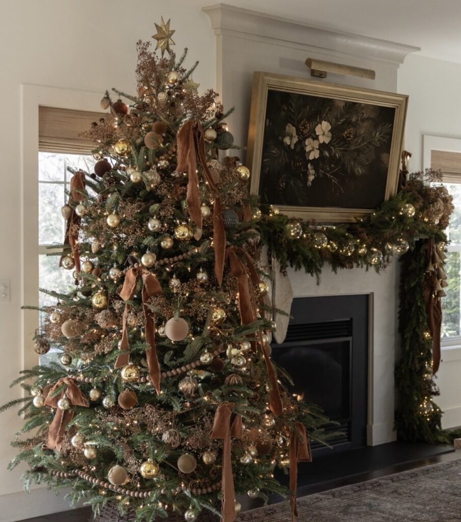 Rich Christmas tree with layered brown decorations, warm lights, and elegant neutral accents