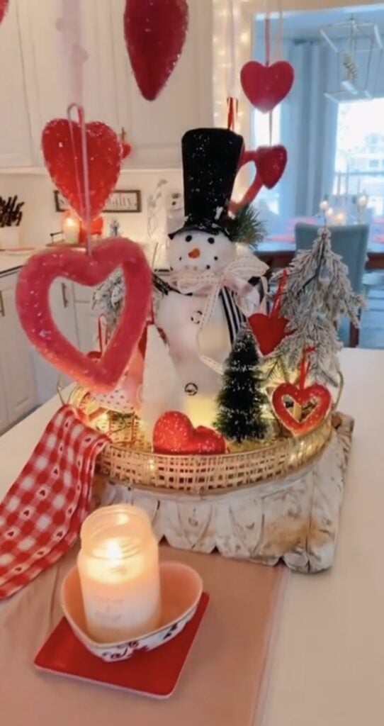 Red Valentine’s Day tiered tray decor with hearts, neutral layers, a snowman and cozy farmhouse-style accents.