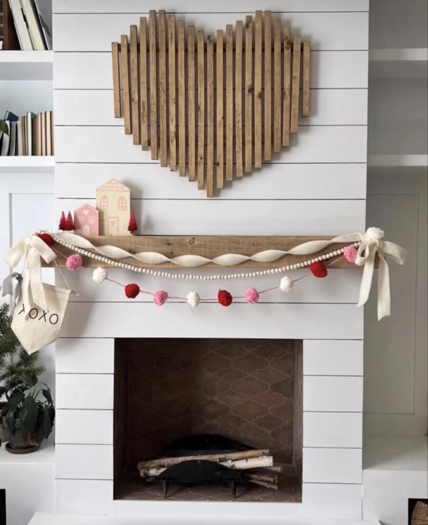 Valentine mantel decor with heart garland, and wooden heart decor