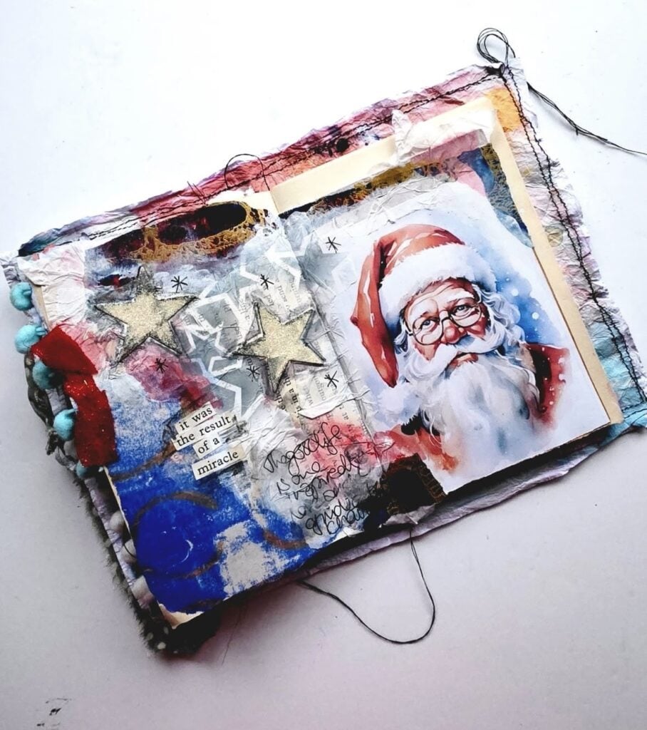 Santa scrapbook page with vintage Santa image, red patterned fabric, candy canes and layered Christmas details