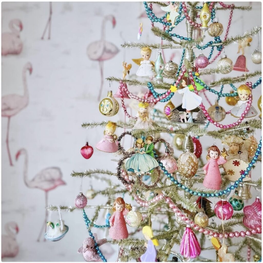 Pink and colorful Christmas tree with unique decorations and playful holiday style