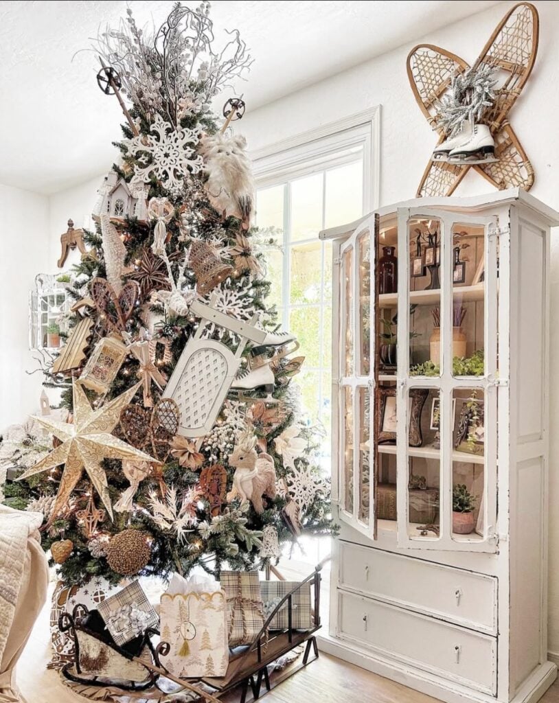 Winter-themed non-traditional Christmas tree with snowy decorations and vintage holiday style