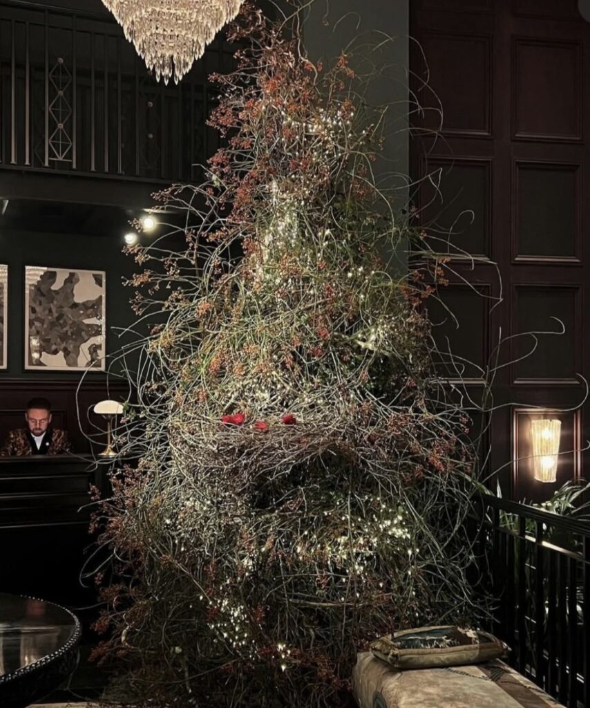 Bird nest Christmas tree with nature-inspired decorations and unique holiday styling