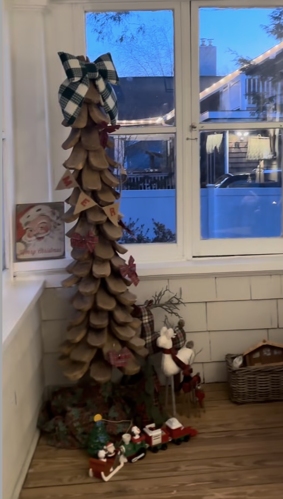 Wooden Christmas tree decorated in a simple non-traditional holiday style