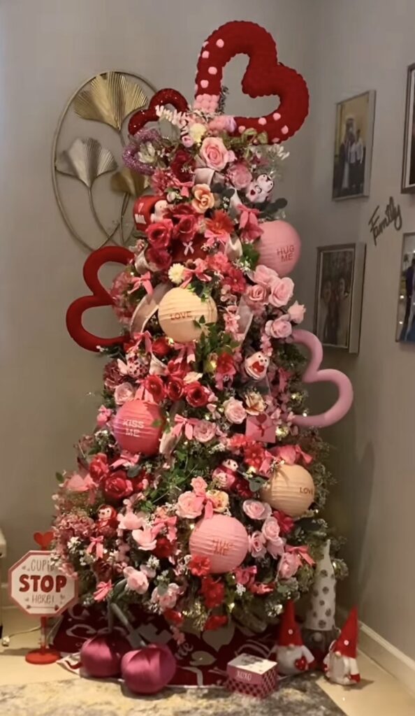 Valentines Day tree decorated with oversized hearts, pink ribbon, and sparkly accents, credit roseartanddecor.