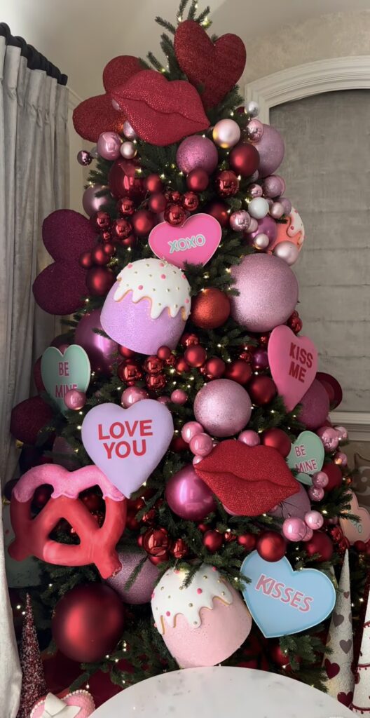 Kissing themed Valentines Day tree styled with sweethearts, red lips, all oversized ornaments, credit oneiradesigns.