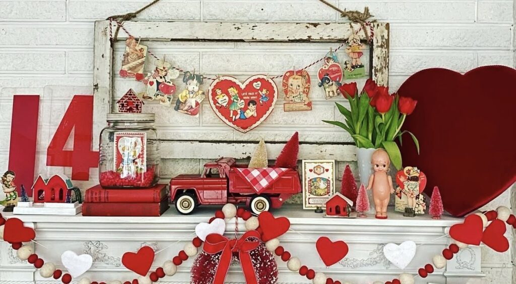 Red Valentine mantel decor with large “14” numbers, heart banner, mini red truck, tulips, and retro accents.