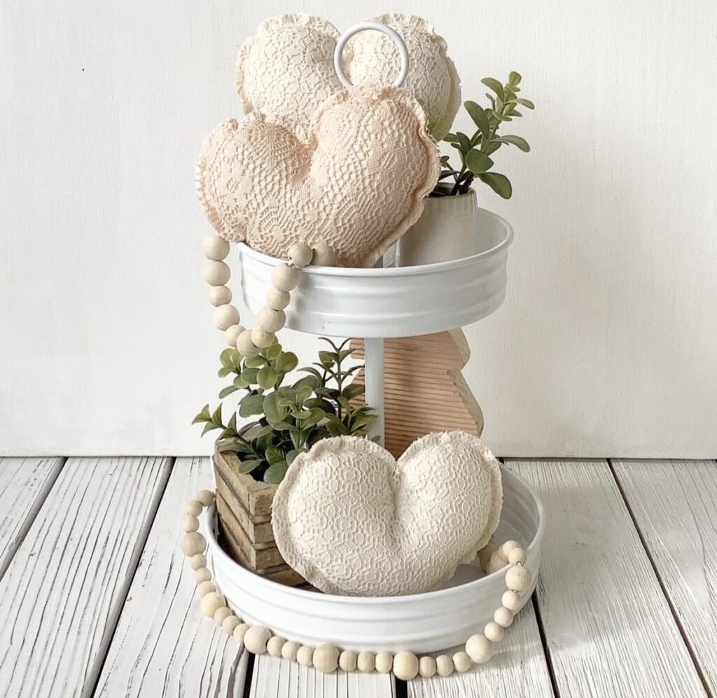 Valentines tiered tray in neutrals with fabric hearts, wooden beads and greenery