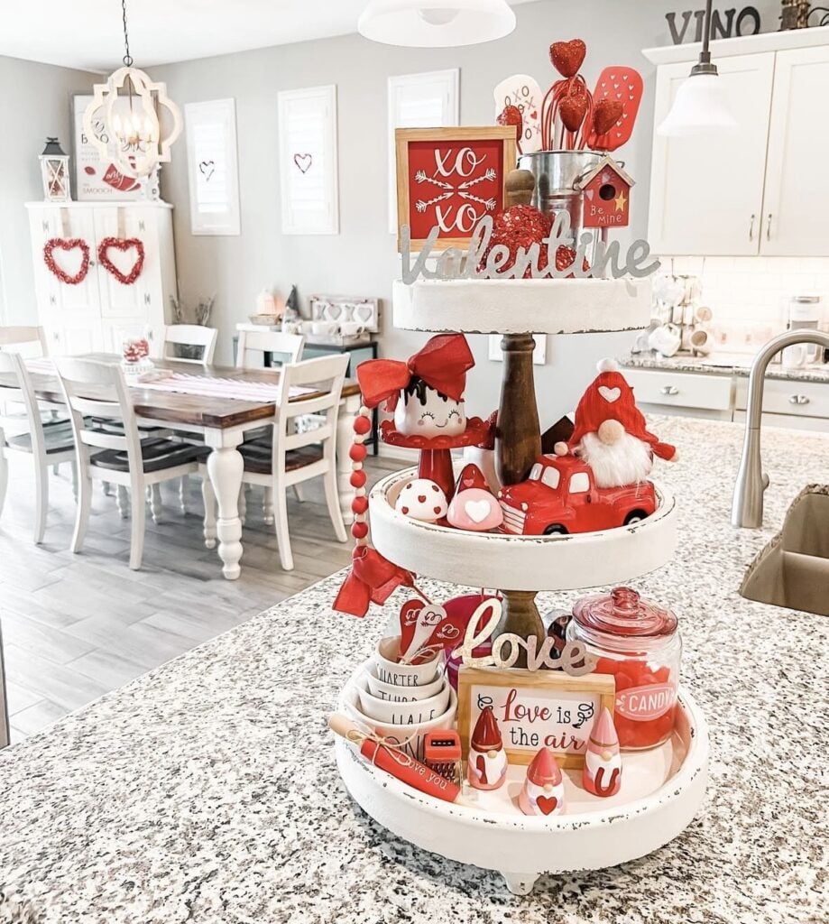 Valentines tiered tray in red and white in a kitchen with dining table in background