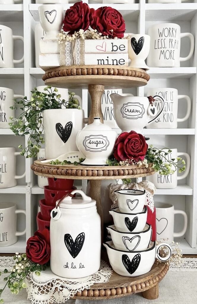 Valentines tiered tray in red and white in a kitchen with rae dunn  kitchen mugs and items