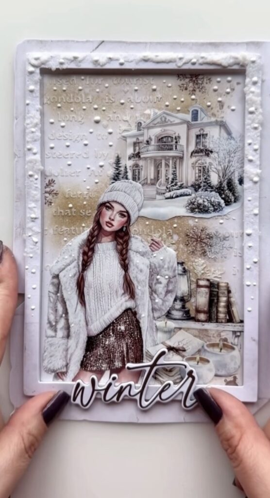 Winter scrapbook journal spread in soft icy blues with layered paper pieces, frames, and a cozy winter theme.
