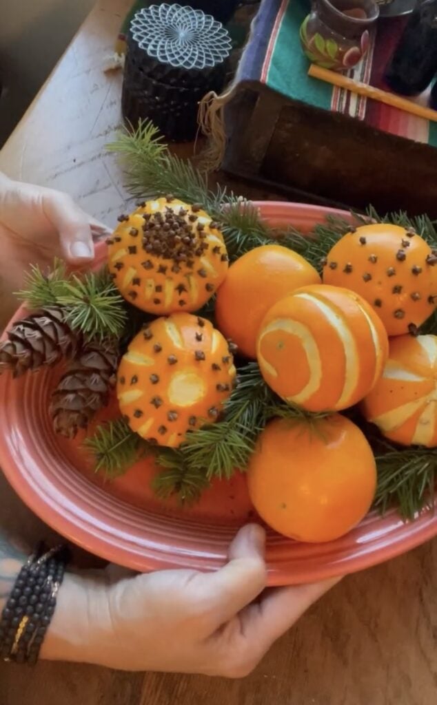 Winter Solstice bowl of oranges peeled into designs