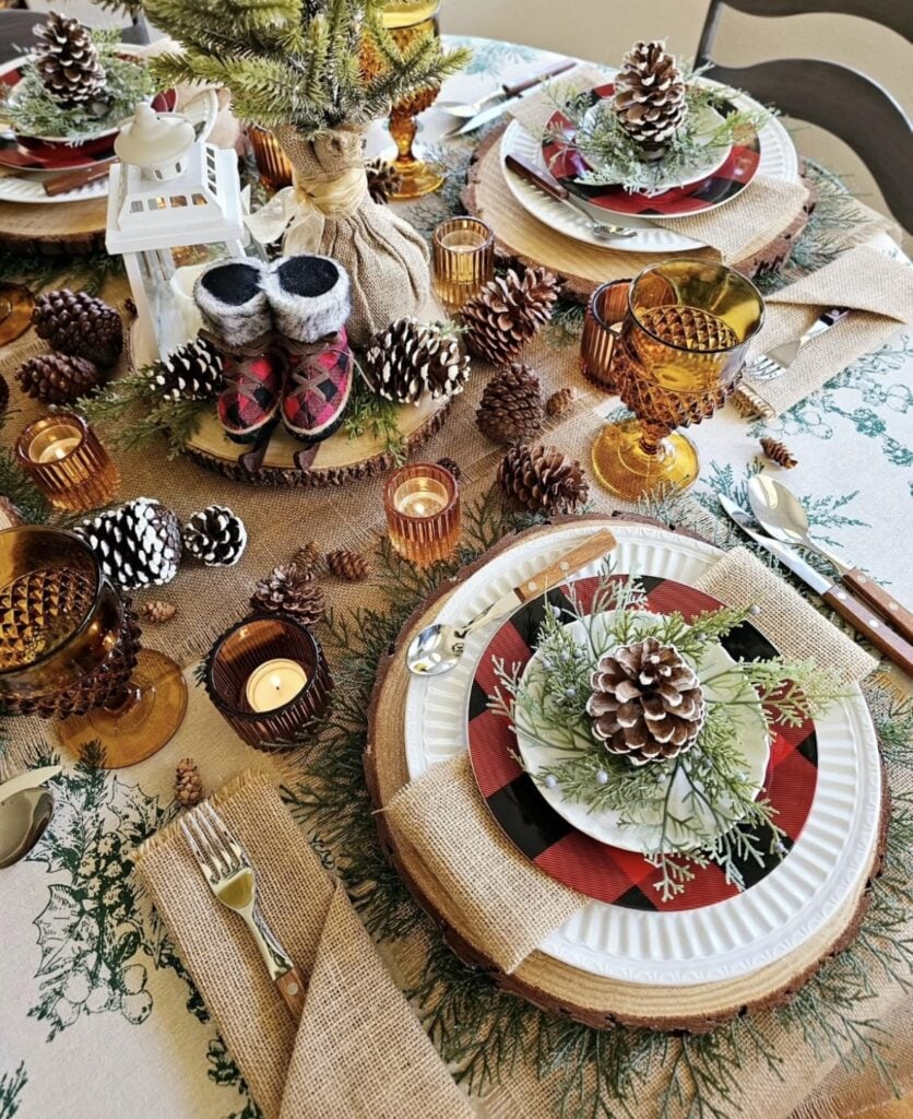 Cozy Winter Solstice table setting with plaid placesettings with pine and pinecone decor