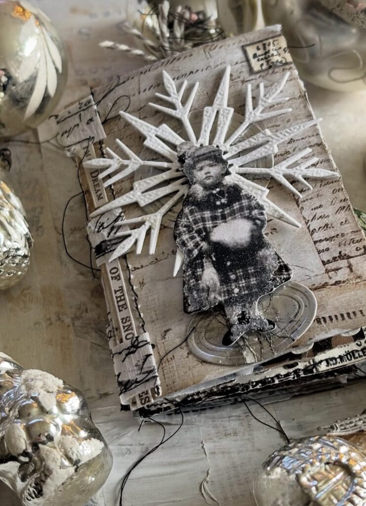 Vintage winter scrapbook layout with distressed paper textures, layered ephemera, and classic winter styling.