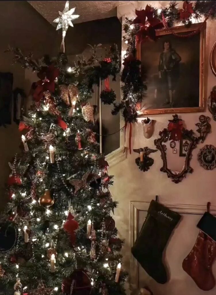 DIY Winter Solstice tree featuring handmade woodland ornaments, evergreen branches, dried oranges, and cozy natural decor.