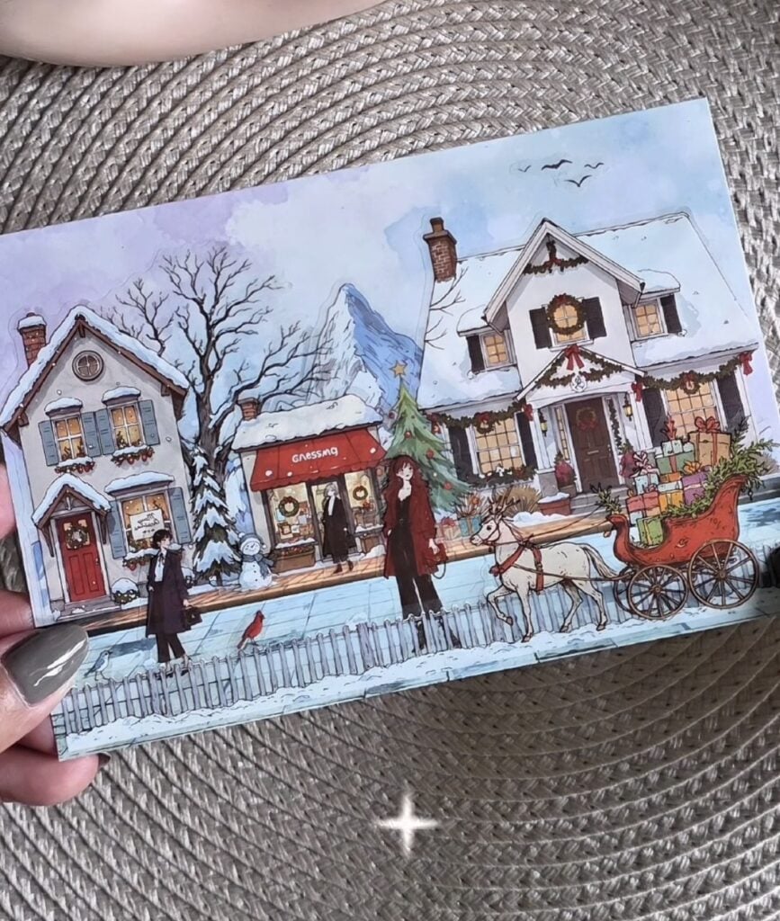 Layered Christmas junk journal page with seasonal paper and mixed media details