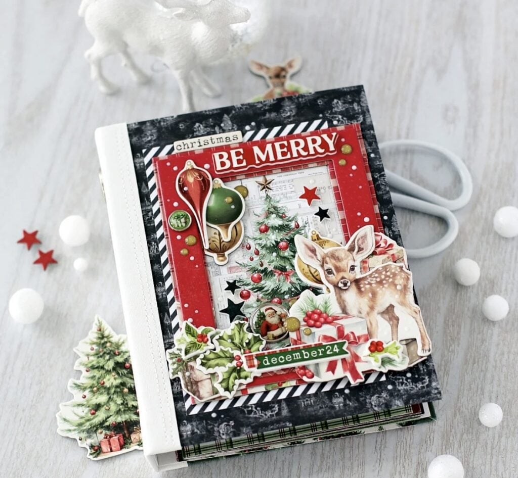 Christmas scrapbook cover with reindeer details, layered paper and festive embellishments