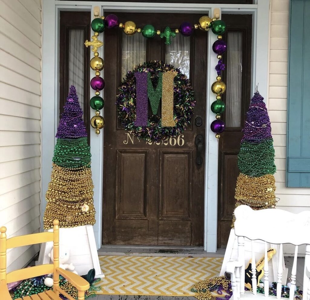 Mardi Gras front door decor with purple, green, and gold accents.