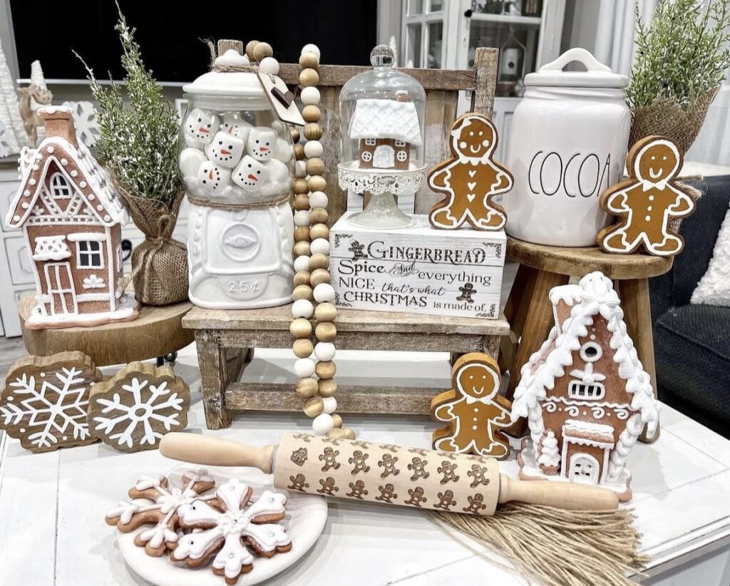 Gingerbread kitchen display with cocoa canister, snowflake cookies, wooden bead garland, and gingerbread houses, featured by slowestuff.com.