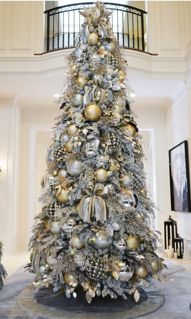 Champagne gold Christmas tree with layered ribbon, sparkling ornaments, and elegant styling.