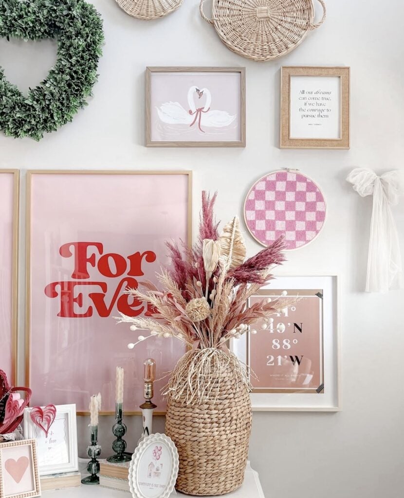 Neutral Valentine’s Day decor with heart pillows, pampas grass in a vase, and soft blush accents.