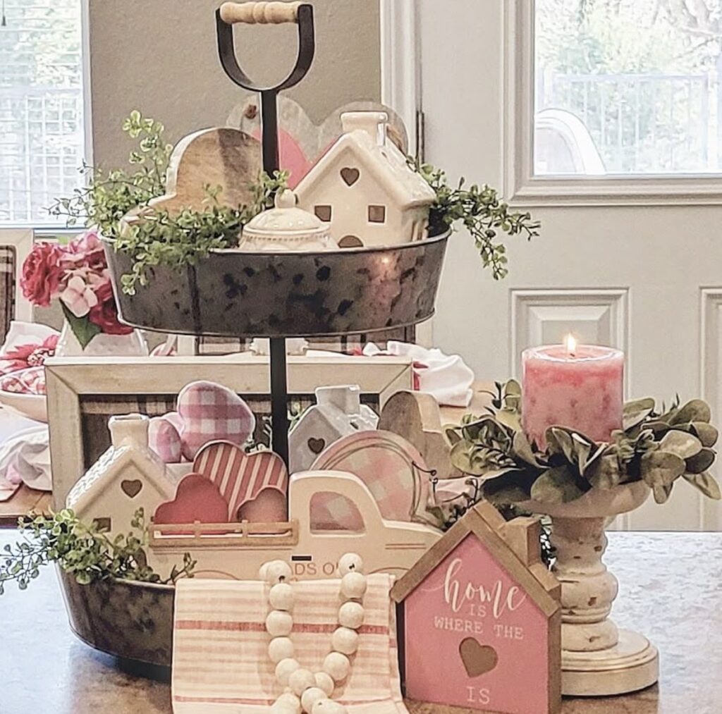 Cute Valentine’s tiered tray with XOXO decor, heart accents, flowers, and a pop of pink.