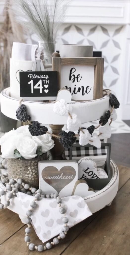 Neutral Valentine tiered tray with soft pink hearts, simple florals, and subtle XOXO accents.