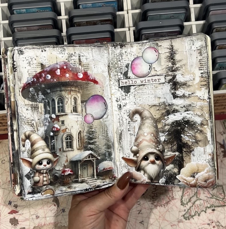 Winter scrapbook page featuring gnomes and a cheerful greeting, with layered winter patterns and accents.