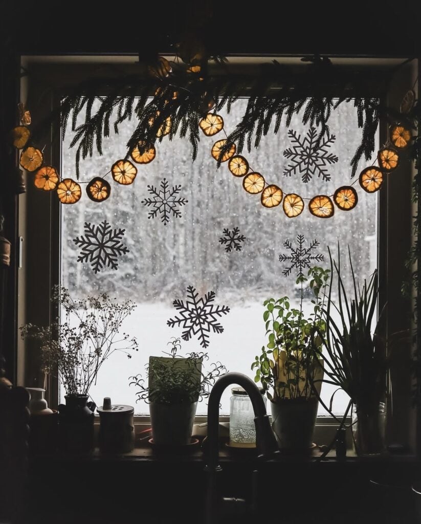 Rustic Winter Solstice decorating inspiration featuring evergreen branches, candlelight, woodland accents, natural textures, and cozy seasonal decor.