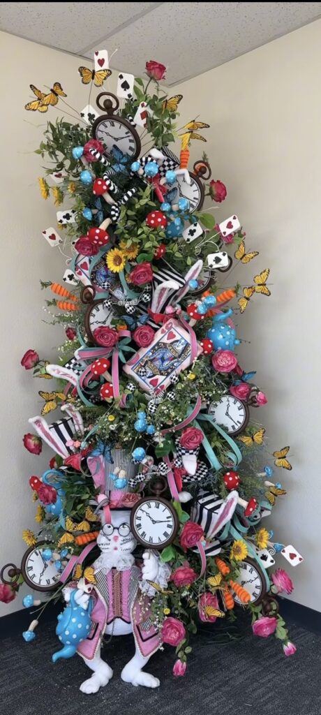 Alice in Wonderland-inspired Easter tree with clocks, playing cards, butterflies, roses, mushrooms, and bunny ears in a whimsical theme.