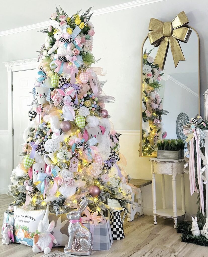Pastel Easter tree decorated with pink roses, bunny faces, gingham ribbon, and soft spring florals, styled in a cozy entryway with bunny decor.