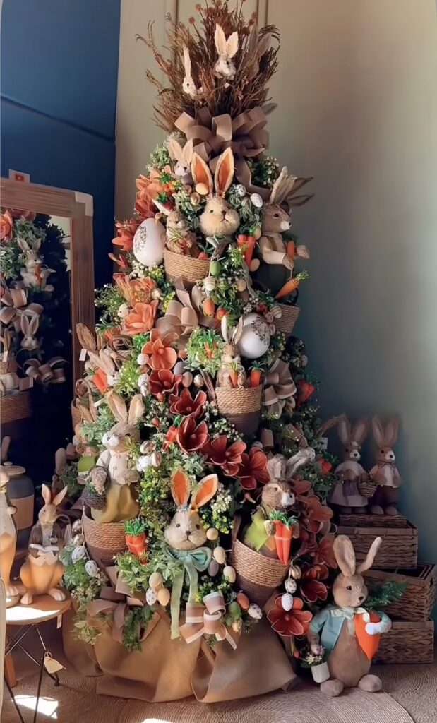 Easter tree decorated with stuffed bunnies, carrots, spring flowers, egg ornaments, and burlap ribbon for a cozy spring look