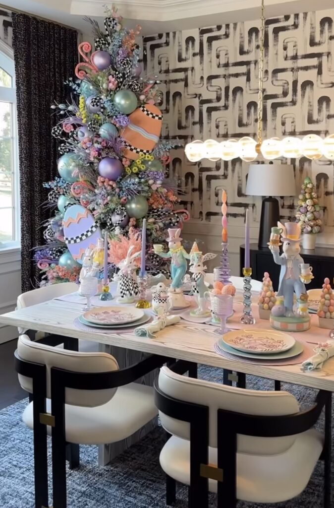 Pastel Easter tree in dining room decorated with oversized Easter eggs, colorful ornaments, and spring table setting