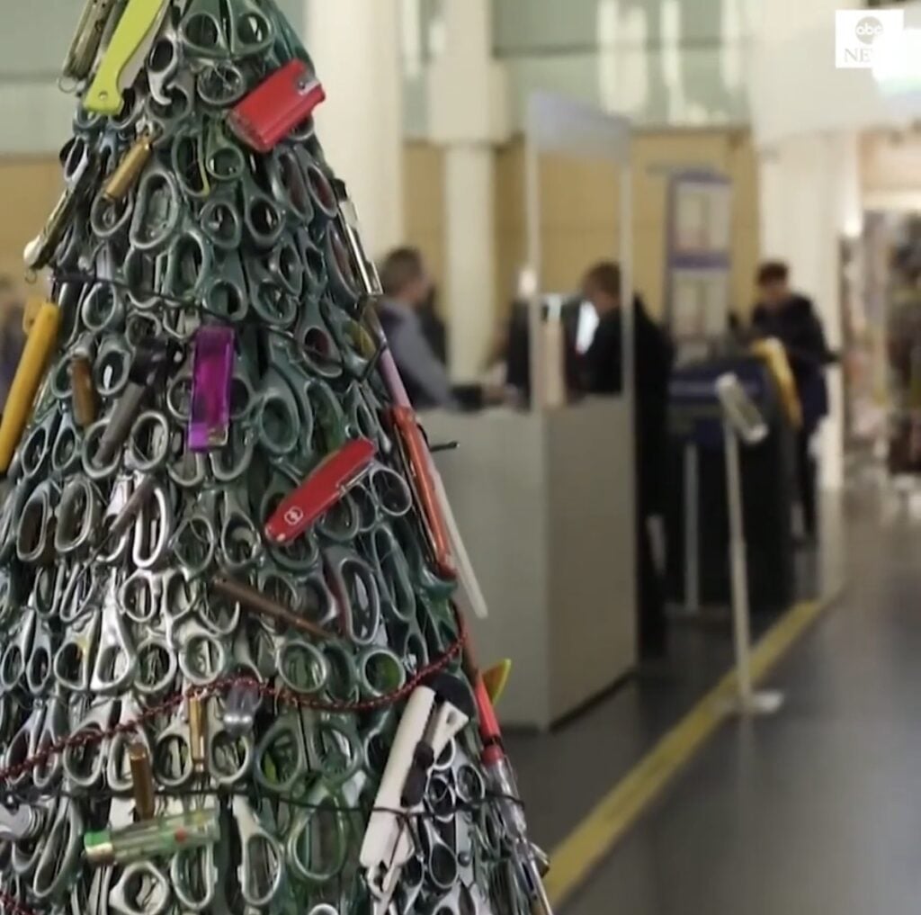 Large non-traditional Christmas tree display with a bold creative holiday design