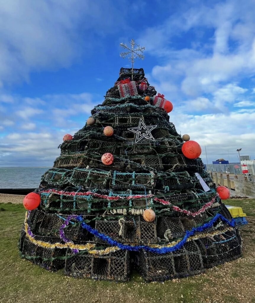 Non-traditional Christmas tree display with bold holiday style and festive shape