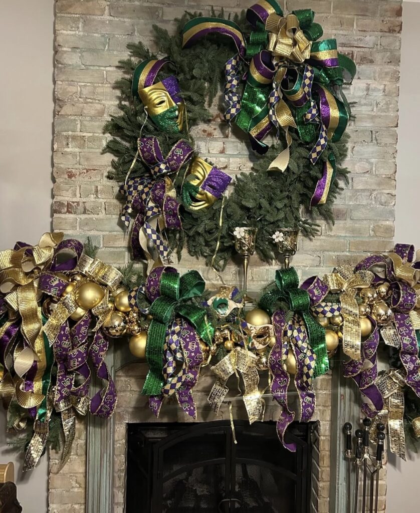 Over-the-top Mardi Gras fireplace mantel decorated with purple, green, and gold ribbon bows, ornaments, and a large wreath with masquerade masks.